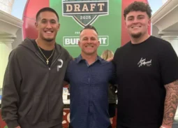 Former Servite coach Troy Thomas, center, stands with wide receiver Tetairoa McMillan and defensive tackle Mason Graham. (Courtesy of Troy Thomas)